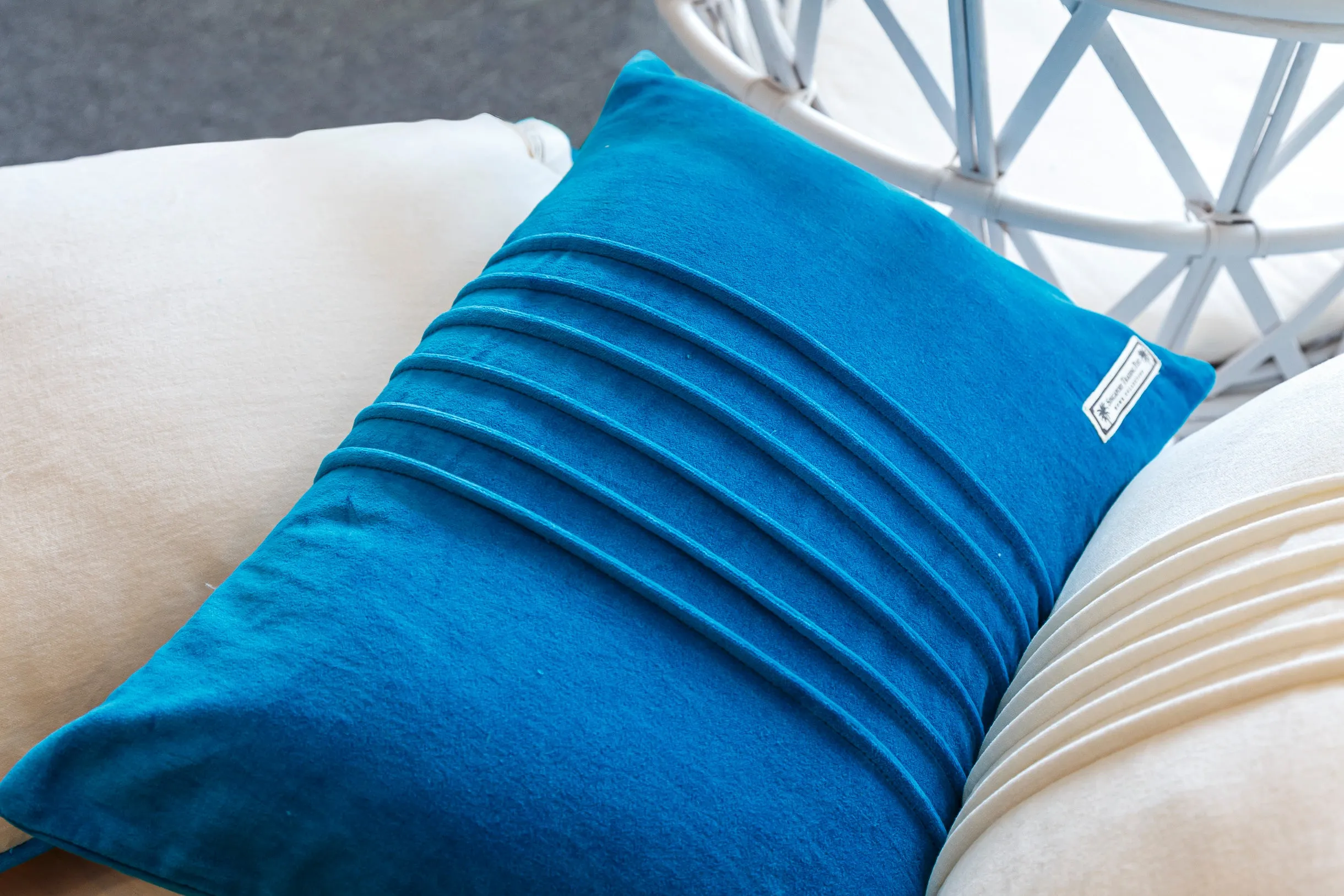 Velvet blue cushion with pin tuck detail